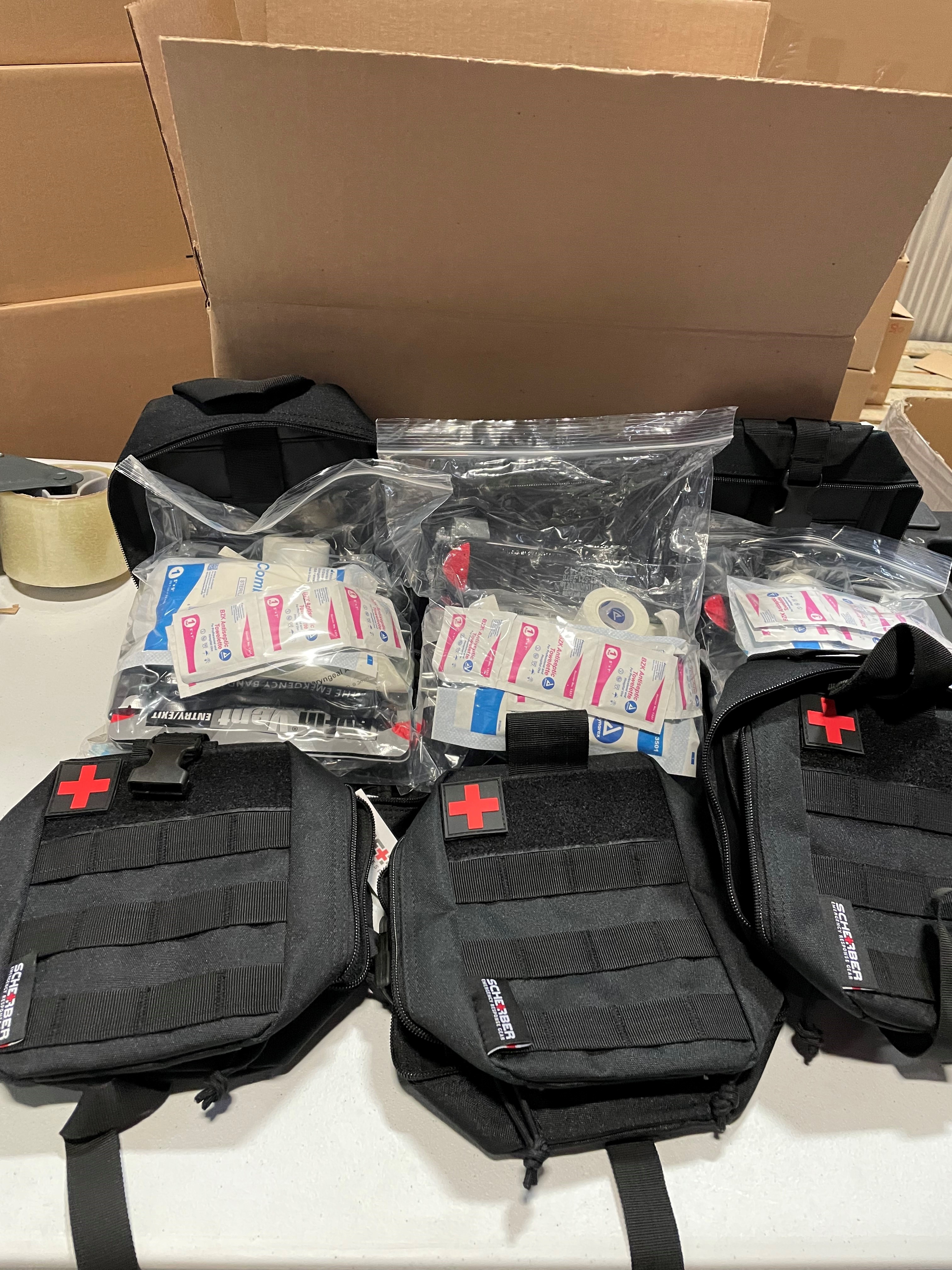 Individual First Aid Kits being packed for shipment to Ukraine